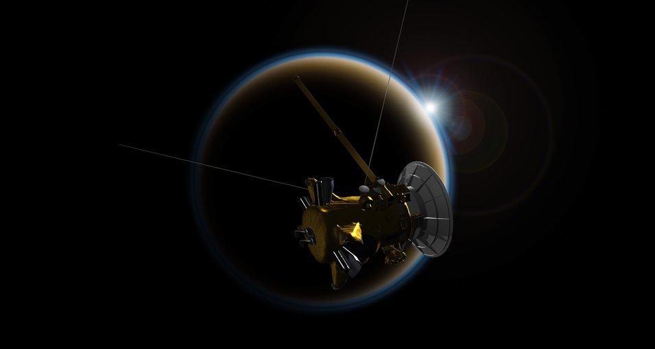 Artist’s rendering of NASA’s Cassini spacecraft observing a sunset through Titan’s hazy atmosphere. Credit: NASA/JPL-Caltech