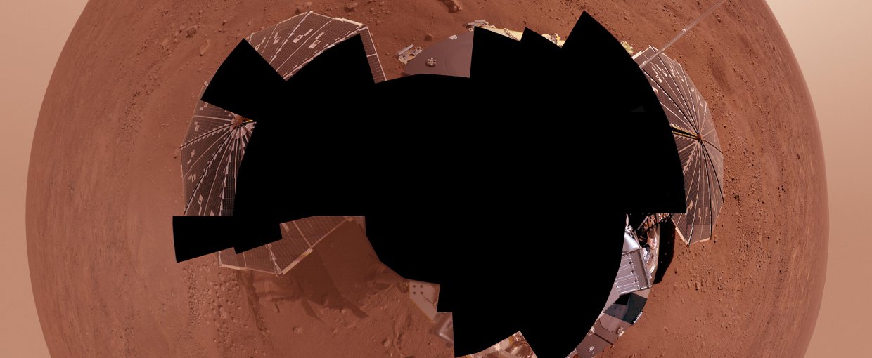 NASA's Phoenix Mars Lander views its surroundings in the Red Planet's northernmost region. The full-circle panorama in approximately true color shows the polygonal patterning of ground at the landing area, similar to patterns in permafrost areas on Earth.