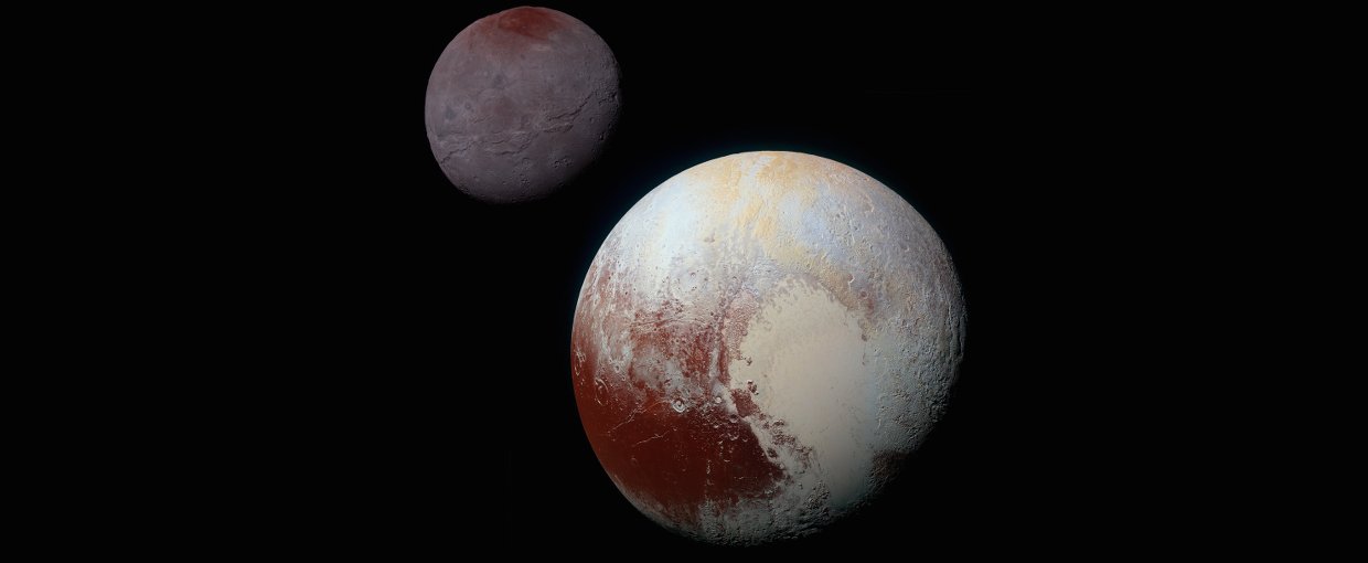 This composite of enhanced color images of Pluto (lower right) and Charon (upper left), was taken by NASA’s New Horizons spacecraft as it passed through the Pluto system on July 14, 2015. This image highlights the striking differences between them.