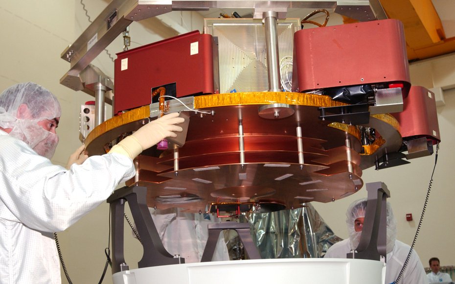 The Impactor Spacecraft being mated with the mounting ring (white ring at bottom of picture with 3 titanium bipods). The thin copper sheets are debris shields to minimize the effects of cometary dust particles hitting the spacecraft.