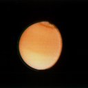 This Voyager 2 photograph of Titan, taken Aug. 23, 1981 from a range of 2.3 million kilometers (1.4 million miles), shows some detail in the cloud systems on this Saturnian moon.